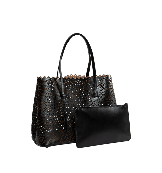 Image 2 of 3 - BLACK - ALAIA Mina 32 Tote Bag featuring graphic perforation, snap-fastening gusseted sides that expand, galvanised silver hardware, detachable leather pouch and hand or shoulder carry. 32 X 25 X 16cm. 100% calfskin. Made in Italy. 