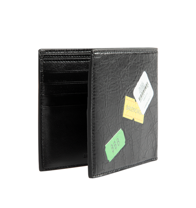 Image 2 of 3 - BLACK - BALENCIAGA Cash Square Folded Wallet in arena lambskin with multicolor printed stickers featuring square folded wallet, Balenciaga logo printed at front, 8 card slots, 2 bill pockets and 2 receipt compartments. L4.3 x H3.7 x W1.1 inch. Lambskin. Made in Italy.