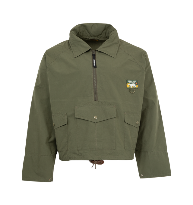 Image 1 of 4 - GREEN - HUMAN MADE Fishing Jacket featuring half-zip jacket with a hood stored in the collar, 3 flap pockets on front, logo on back, cropped fit has a drawstring at the hem and snap buttons on the cuffs. 60%cotton, 40% nylon.