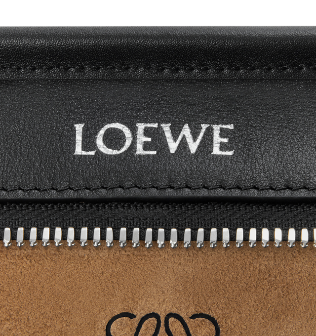 Image 9 of 11 - BLACK - Loewe Mini Amazona 180 Bag in leather features a relaxed silhouette anchored by a single toron top handle, designed to be carried open, while a concealed closure secures the main compartment, removable shoulder and crossbody straps, two carry options: short handle, removable and adjustable crossbody strap, zip closure with two leather zip pullers, two compartments, main compartment closed with magnetic closure, left side d-ring for customization, suede and nappa lambskin lining, and