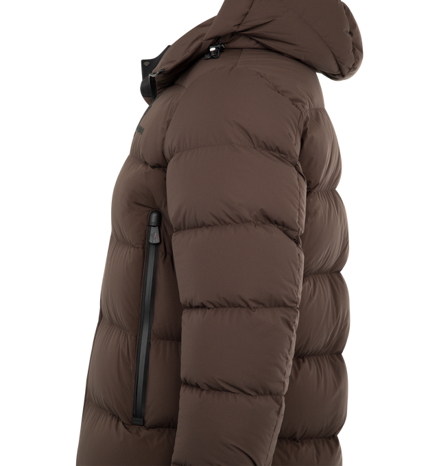 Image 3 of 3 - BROWN - MONCLER Isorno Hooded Down Ski Jacket featuring 2L nylon, micro ripstop lining, down-filled, adjustable hood with 2L technical nylon lining, YKK AquaGuard highly water-resistant zipper closure, external pockets with YKK AquaGuard highly water-resistant zipper closure, inner media pocket, ski pass pocket, powder skirt, stretch jersey cuffs, adjustable hem with drawstring fastening and embossed logo. 100% polyamide/nylon. Lining: 100% polyester. Padding: 90% down, 10% feather. Made in R