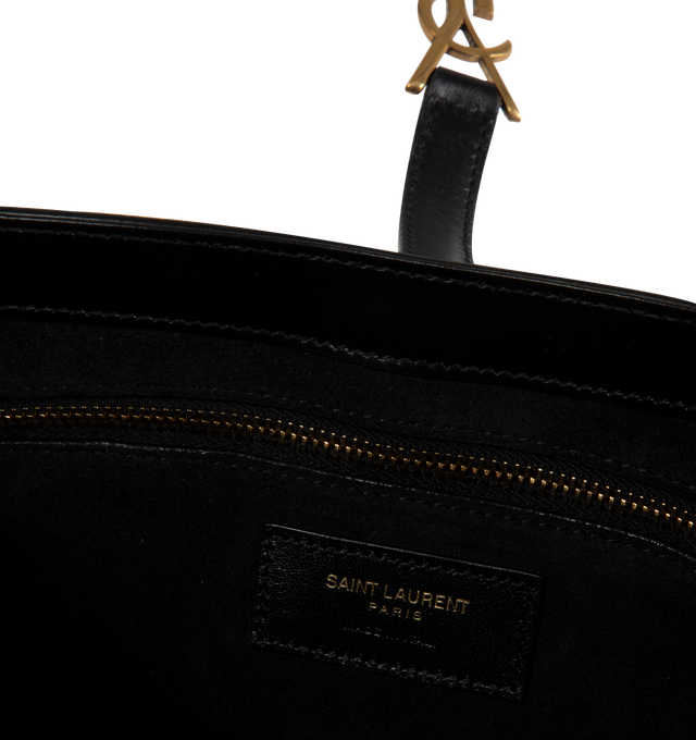 Image 3 of 3 - BLACK - SAINT LAURENT LE 5 7 leather shoulder bag featuring gold hardware, leather tab with THE CASSANDRE, and tonal suede lining. Compact and SPACIOUS, it features an interior zipped pocket and adjustable shoulder strap. Dimensions: 9 x 6.2 x 2.5 inches with 7.8 inch strap drop. Calfskin leather. Made in Italy.