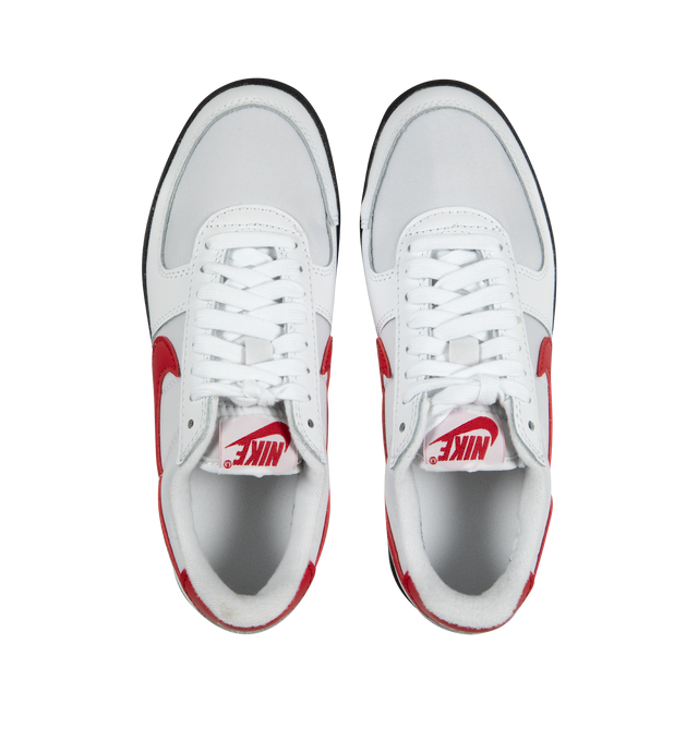 Image 5 of 5 - WHITE - NIKE Field General '82 in White and Varsity Red with a vintage gridiron look and red Swoosh.  A mix of smooth leather, synthetic leather and tough textiles come together in classic White and Varsity Red, resting atop a nubby Black rubber waffle sole.  Featuring textile Upper with leather overlays, woven tongue label, printed branding at back and rubber outsole. 
