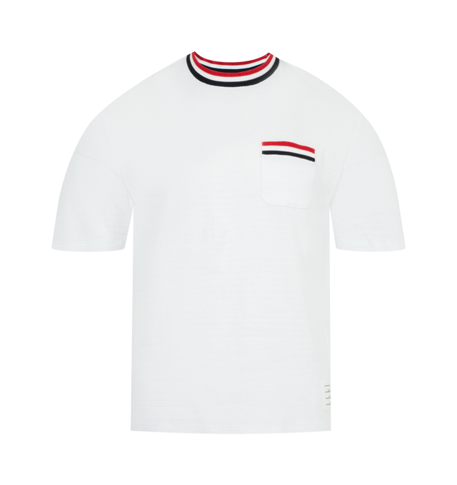Image 1 of 3 - WHITE - THOM BROWNE Striped Trim Tee featuring chest patch pocket, name tag applique, buttoned side vents with signature striped grosgrain trim, short sleeves and signature striped grosgrain loop tab. 100% cotton. Made in Italy.