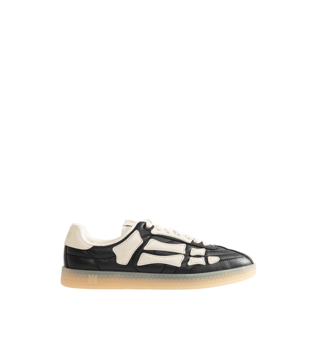 Image 1 of 5 - BLACK - Amiri Mens Pacific Football Sneakers are crafted with a leather upper and signature pebbled leather bone appliqus. Feature contrast topstitching, lace-up closure, padded collar, two-tone rubber sole, and low-top silhouette. Main Material: Leather Upper; Sole: Rubber. Made in Vietnam.