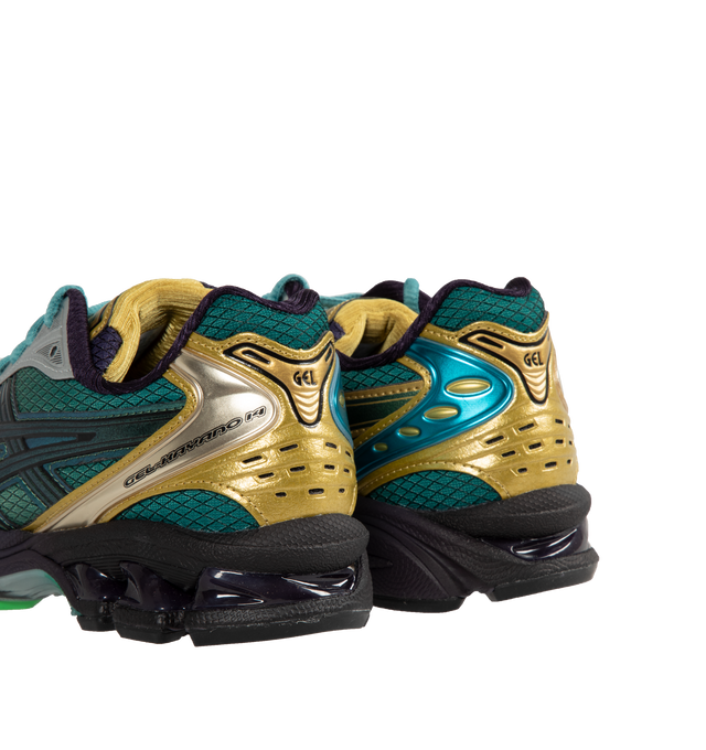 Image 3 of 5 - GREEN - Asics GEL-KAYANO 14 sneaker inspired by earth tones found in nature and incorporating rip-stop underlays and tonal color blocking for a technical appearance. Mirroring the original midsole tooling with GEL technology cushioning, this shoe helps create advanced cushioning in everyday scenarios. Features Original inspired tooling, GEL technology cushioning for shock absorption, and TRUSSTIC support system.