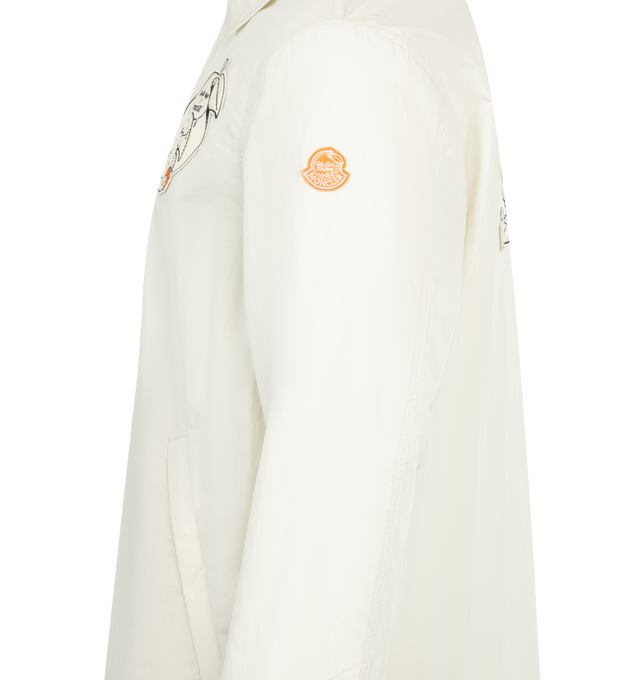Image 3 of 3 - WHITE - Moncler x Gilga Farm Designed by Donald Glover Satsuma Shirt Jacket featuring cotton and nylon canvas, collar, zipped pockets, hem with adjustable drawstring fastening and embroidered cartoon and logo patches. 66% cotton, 34% polyamide/nylon. Made in Romania.