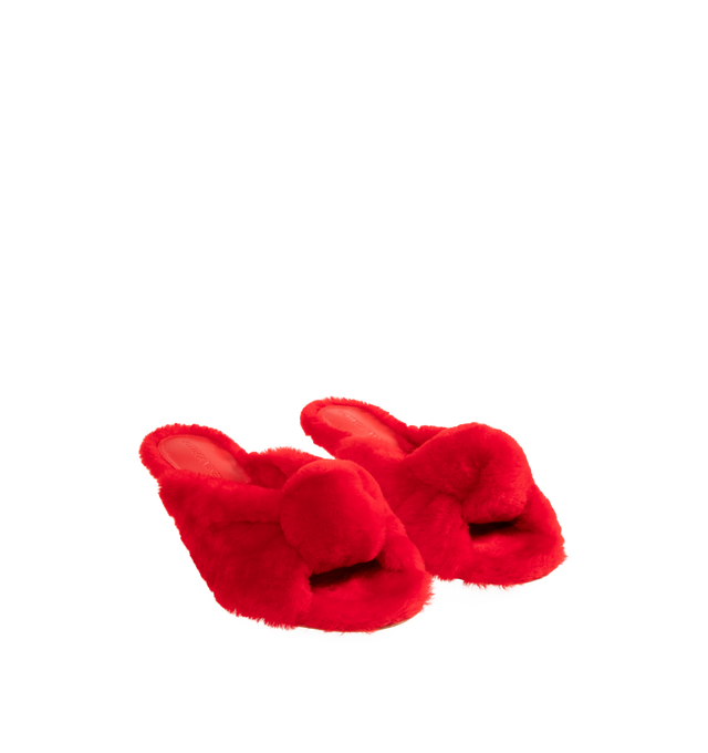 Image 3 of 5 - RED - BOTTEGA VENETA Cherry Mule featuring kitten heel mule sandal in soft merino shearling and a cushioned signature knot detail. Merino shearling. Lining: lambskin. Rubber-injected leather outsole. Made in Italy.