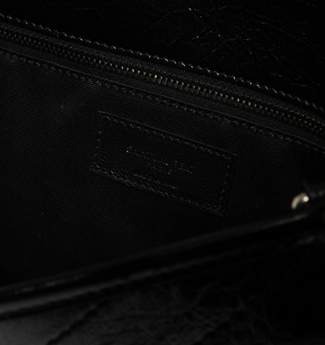 Image 4 of 4 - BLACK - Saint Laurent Womens Shoulder Bag is crafted from vintage calfskin leather. Features signature Cassandre logo, chevron-quilted topstitching, sliding chain strap for shoulder or crossbody wear, magnetic flap closure, three main compartments, one flat pocket, one zip pocket, cotton lining, and silver-tone hardware. Main Material: Calfskin Leather; Lining: Cotton; Hardware: Silver. Made in Italy.