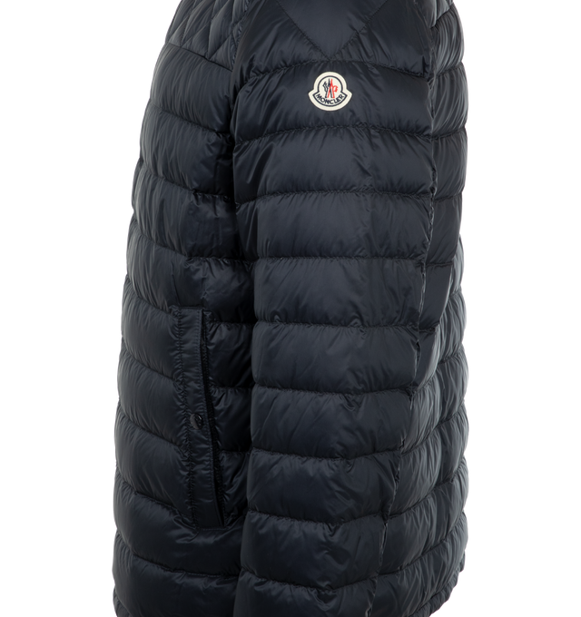 Image 3 of 3 - NAVY - Moncler Benamou Short Down Jacket has a mock neckline, a 2-way zip front closure, snap pockets and cuffs, a tricolor stripe placket, and diamond quilting details. Down and feather fill. 100% polyamide.
