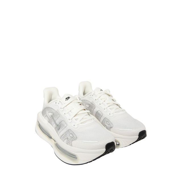 Image 2 of 5 - WHITE - Nike Women's Vomero Premium Running Shoes feature an engineered mesh upper for lightweight breathability and a secure fit. Designed for maximum cushioning, these performance running shoes combine a full-length ZoomX foam midsole with dual Air Zoom units at the forefoot and heel for exceptional comfort, responsive energy return, and a smooth ride. A durable Waffle rubber outsole provides reliable traction for everyday miles. Main Material: Mesh. Midsole: ZoomX Foam with Dual Air Zoom U