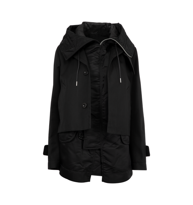 Image 1 of 3 - BLACK - SACAI Cotton Gabardine Blouson featuring layered construction, a nylon asymmetrical design with a stand collar, a drawcord hood, long sleeves and button-front closure. 63% cotton, 37% polyester. Combo: 100% nylon. Made in Japan.