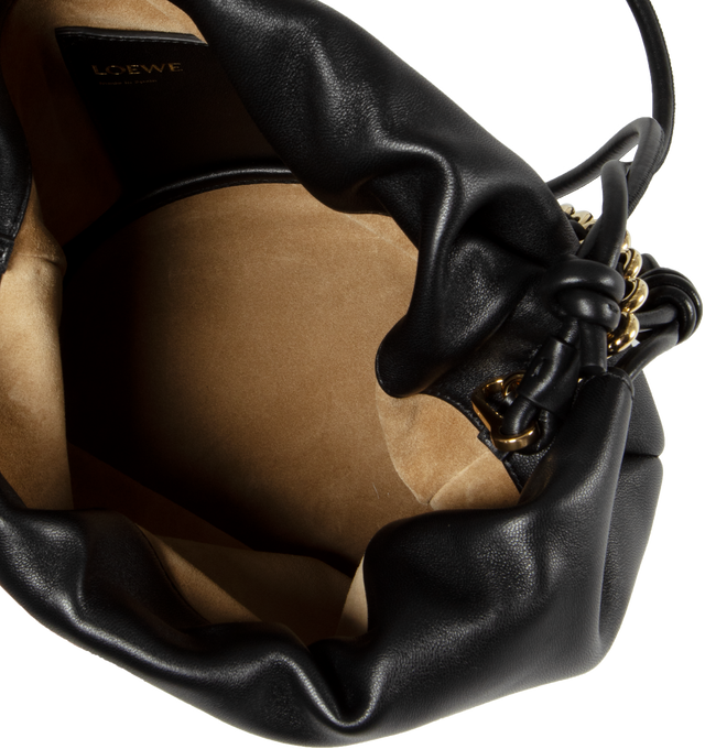 Image 3 of 3 - BLACK - Loewe Paula's Ibiza Flamenco Purse crafted in mellow nappa lambskin in a ruched design with signature knots at the sides in a new everyday size that can be worn over the shoulder using the donut chain or crossbody with the accompanying leather strap. Featuring detachable and adjustable leather strap for shoulder, crossbody or hand carry and detachable donut chain adorned with Anagram engraved Pebble. Discreet magnetic closure, suede lining and embossed LOEWE. Height (inch): 9.4 X Widt 