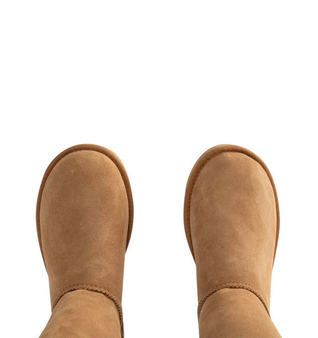 Image 4 of 4 - BROWN - Ugg Women's Classic Ultra Tall Boot is a sky-high version of the iconic style. Featuring a 15-inch shaft height, plush sheepskin lining, and an ultra-lightweight rubber outsole for comfort. Main Material: 17mm Twinface Sheepskin. Lining: 17mm Sheepskin. Insole: 17mm Sheepskin. Sole: Sugarcane EVA. Details: Overlock Stitch Seams.