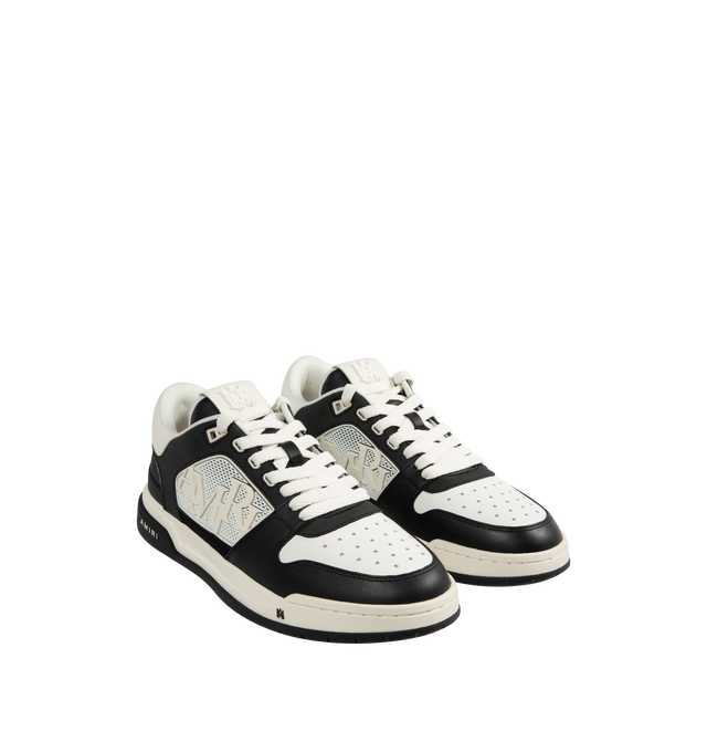 Image 2 of 5 - BLACK - Amiri Men's Classic Low Sneaker is a lace-up style crafted on a rubber sole with leather upper and central panels of molded rubber mesh framing the AMIRI staggered logo. Made in Vietnam. Upper: Leather. Sole: Rubber.