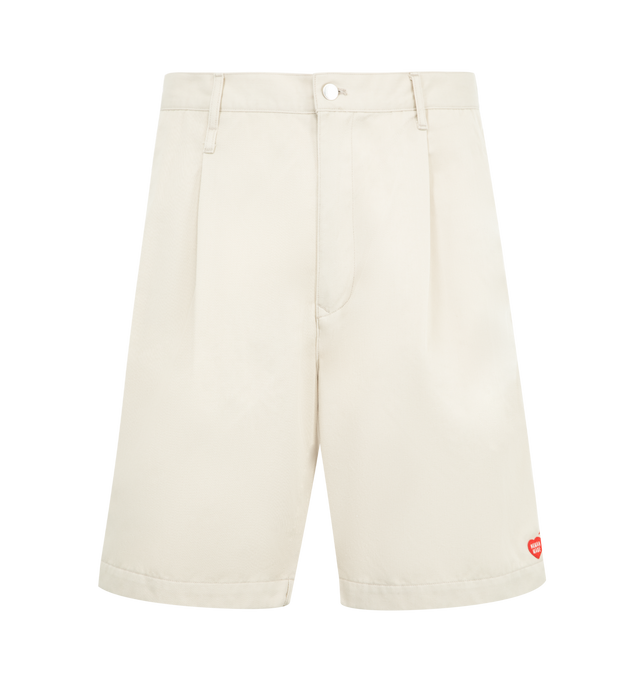 Image 1 of 3 - WHITE - HUMAN MADE Skater Shorts featuring relaxed fit, lightweight polyester-cotton twill, two tucks on the front, zip fly with branded button, total of six pockets, brand logo above the right side pocket, heart button on the right back pocket and heart patch on the front left hem. 65% polyester, 35% cotton. Made in Japan..
