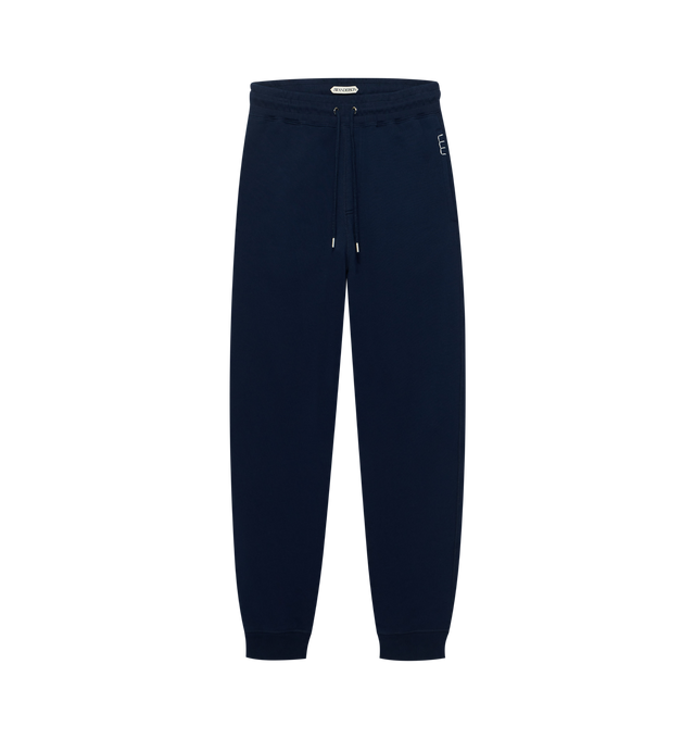 Image 1 of 1 - NAVY - JW Anderson Men's Cuffed sweatpants in navy jersey. Features an elasticated waist and adjustable drawstring, with cuffed hems. Finished with loafer stitching details on the pockets. 100% Cotton. Made in Portugal.