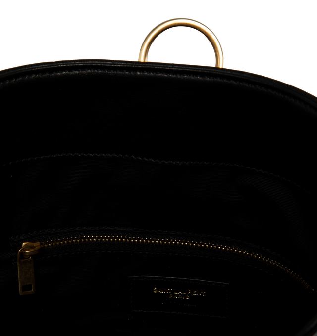 Image 4 of 5 - BLACK - SAINT LAURENT Cecile Duffle Sport featuring barrel bucket bag, quilted topstitching, sliding strap, snap button closure and cotton lining. 7.9 X 12.6 X 7.9 inches. Strap drop: 14.6 inches. 90% lambskin, 10% metal. 