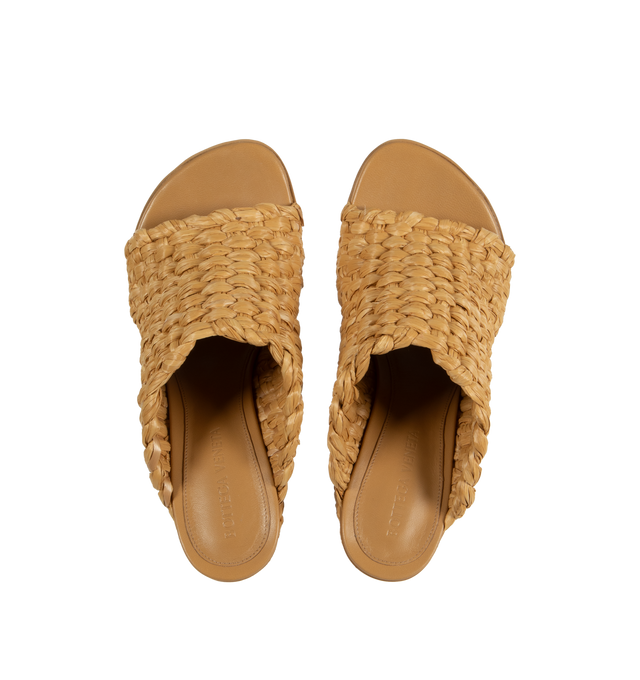 Image 4 of 4 - BROWN - BOTTEGA VENETA Atomic Intrecciato Raffia Sandals featuring woven raffia into a towering silhouette set atop a thick cylindrical heel, rubber-gripped soles and slips on. 4" heel. Raffia. Made in Italy. 