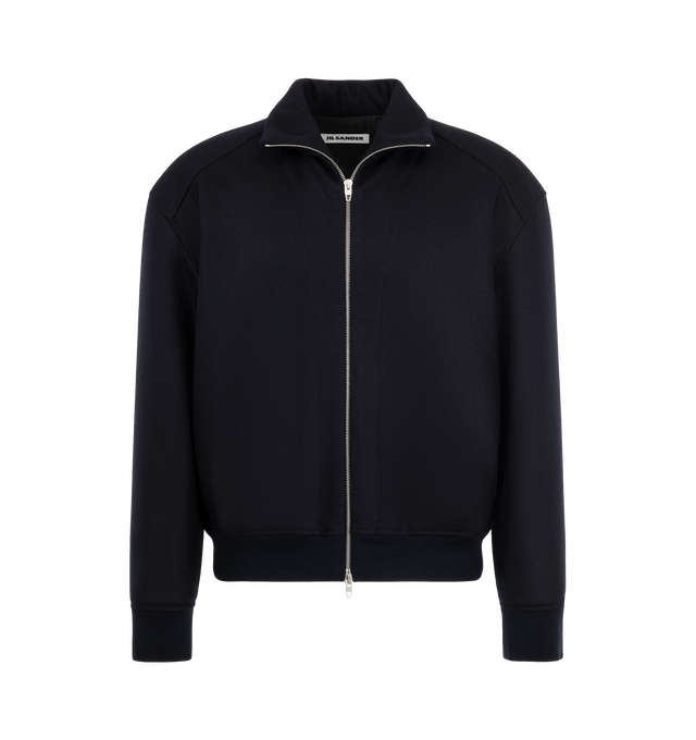 Image 1 of 3 - NAVY - Jil Sander Men's Padded Zip-Up Wool Jacket is crafted from technical faille and features a relaxed-fit silhouette with dropped shoulders, a stand collar, and a pack-away hood concealed within the collar. Designed for versatile everyday wear, this lightweight jacket is finished with a front zip closure, side welt pockets, a drawstring waist, elasticized cuffs, and a signature Jil Sander logo application at the sleeve. Main Material: Wool. Made in Italy.