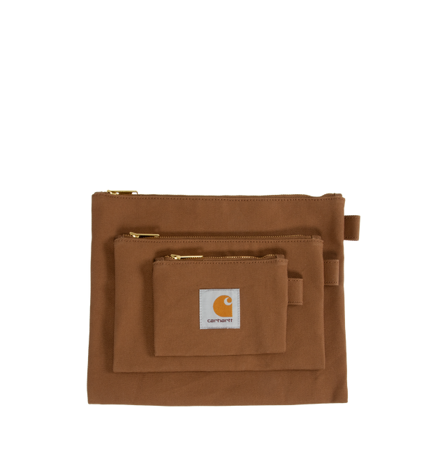 Image 1 of 3 - BROWN - CARHARTT WIP Canvas Pouch Set comprised of three pouches in different sizes, constructed from lined cotton Dearborn Canvas with a waxed finish, zip closure and a woven Square Label appears on each piece. Pouch 1: 10.2 x 8.3 inch. Pouch 2: 8.3 x 5.1 inch. Pouch 3: 5.1 x 3.5 inch. 100% cotton (Dearborn Canvas).
