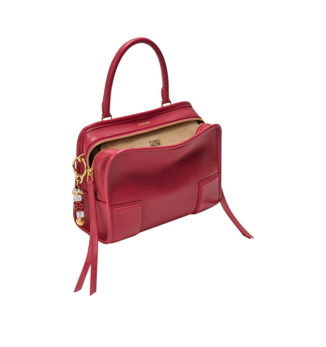 Image 18 of 18 - RED - Loewe Small Amazona 180 Bag in leather features a relaxed silhouette anchored by a single toron top handle, designed to be carried open, while a concealed closure secures the main compartment, three carry options: short handle, removable shoulder strap and crossbody, zip closure with two leather zip pullers, two compartments, main compartment closed with magnetic closure, internal flat pocket, left side d-ring for customization, nappa lambskin lining, and embossed double L branding. L