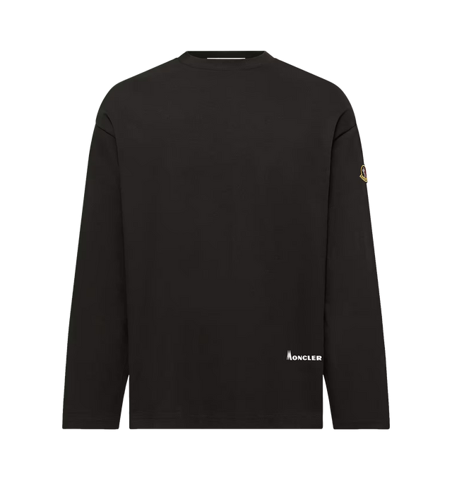 Image 1 of 1 - BLACK - Moncler Men's K2 Print Long Sleeve T-Shirt is crafted from cotton jersey and features an oversized-fit silhouette, a classic crew neckline, and long sleeves. A graphic K2 print inspired by Vittorio Sella's celebrated 1909 photograph of the mountain reflects the pioneering spirit at the heart of Moncler's alpine heritage. Main Material: 100% Cotton.