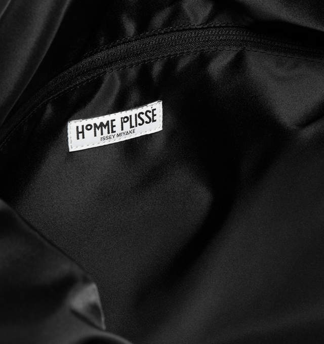 Image 3 of 3 - BLACK - ISSEY MIYAKE Pleats Travel Bag featuring large-capacity bag that can be worn on the shoulder or across the body, interior pockets and pleats. 100% polyester. Lining: 100% nylon. Made in Japan.