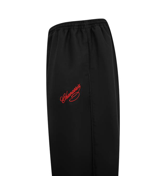 Image 3 of 3 - BLACK - WILLY CHAVARRIA Ruff Rider Pant featuring elasticated waistband, two pockets on the front, welt pockets on the back and embroidered branding on the front. 100% nylon.
