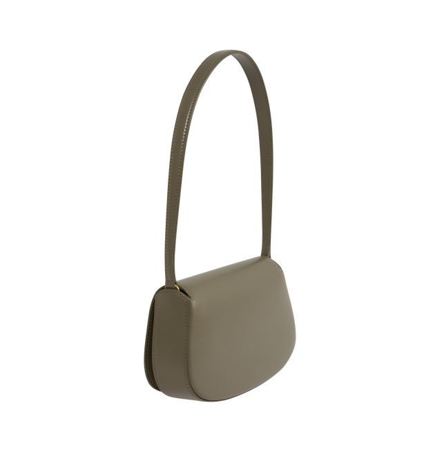 Image 2 of 3 - GREEN - SAINT LAURENT Mini Voltaire half-moon shoulder bag in calfskin with gently polished finish. Features a flap with magnetic Cassandre hinge closure and one flat interior pocket. Calfskin leather with leather lining and bronze-tone hardware. Made in Italy. Measures 8.3" X 4.3" X 1.8" with 9.4" strap drop.