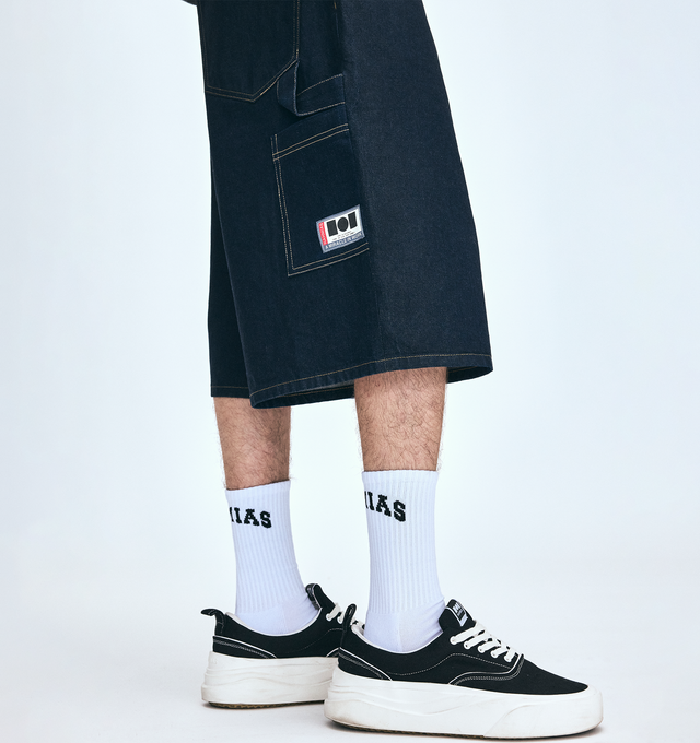 Image 7 of 9 - BLACK - NAHMIAS Ollie Sneaker featuring round rubber cap toe, lace up closure, textile logo patch at tongue, branded logo detail on outsole lip, padded tongue and collar, treaded logo outsole, rubber midsole, logo emboss on heel and logo gum bottom.