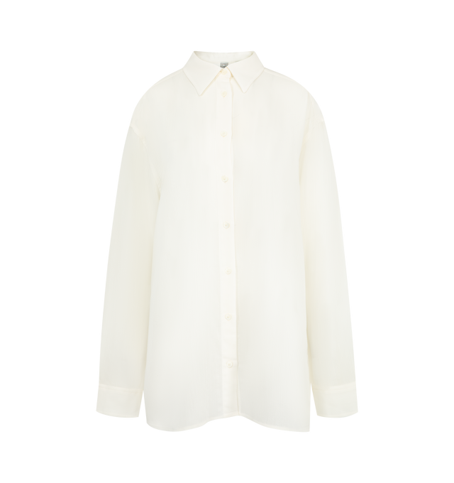 Image 1 of 2 - WHITE - Toteme Classic shirt reworked in fluid, semi-sheer crepe to complement sharp office looks. It has a longline, oversized silhouette with dropped shoulders and a buttoned placket and cuffs. 83% viscose, 17% wool. Made in Portugal.