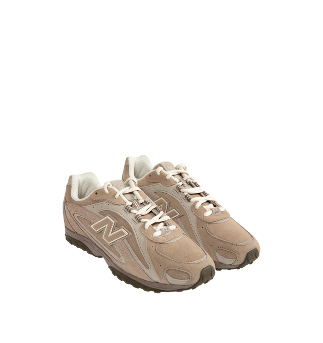 Image 2 of 5 - BROWN - New Balance 204L sneaker featuring a low-profile silhouette, slim structure of '70s running shoes, tech-inspired texture of premium suede, multi-piece upper with embossed overlay, double-stacked suede 'N' logo, and screen-printed graphics along the saddle. Distinctive outsole with 2000s-inspired strike path and 70s-influenced tread pattern. Outer: Calf Suede 100%, Lining: Fabric 100%, Sole: Polyethylene vinyl acetate (PEVA) 100%. Made in Vietnam.