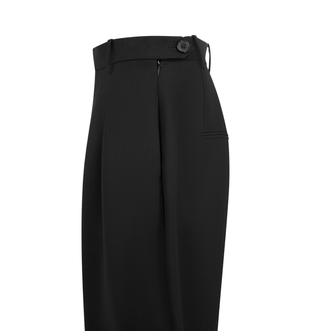 Image 4 of 4 - BLACK - KHAITE Dugan Pant featuring mid-rise, designed to fit wider and softer at the thighs, tapered toward the ankle, doubled forward pleats, in-seam side pockets, triangular pocket at hip, back welt pockets and side zipper. 100% polyester.