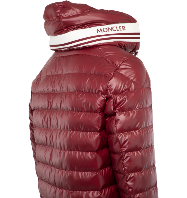 Image 3 of 4 - RED - MONCLER Cornour Padded Jacket featuring two-way zip fastening, adjustable hood, padded insulation, and rubberised logo and striped detailing across the hood. 100% polyester. Padding: 90% down, 10% feather. Made in Moldova. 