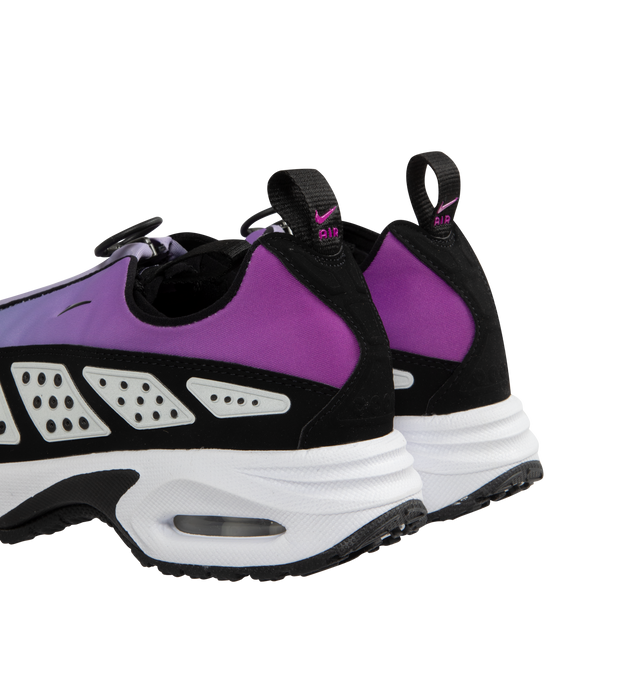 Image 3 of 5 - PURPLE - NIKE Air Max SNDR Sneaker featuring Max Air cushioning bubblem, zip-off shroud reveals the number 6453; which spells NIKE on phone keyboards, removable insole, lace-up style, visible Max Air unit in the heel provides clear Air-Sole cushioning, reflective details enhance visibility in low light or at night, synthetic and textile upper and lining/rubber sole.