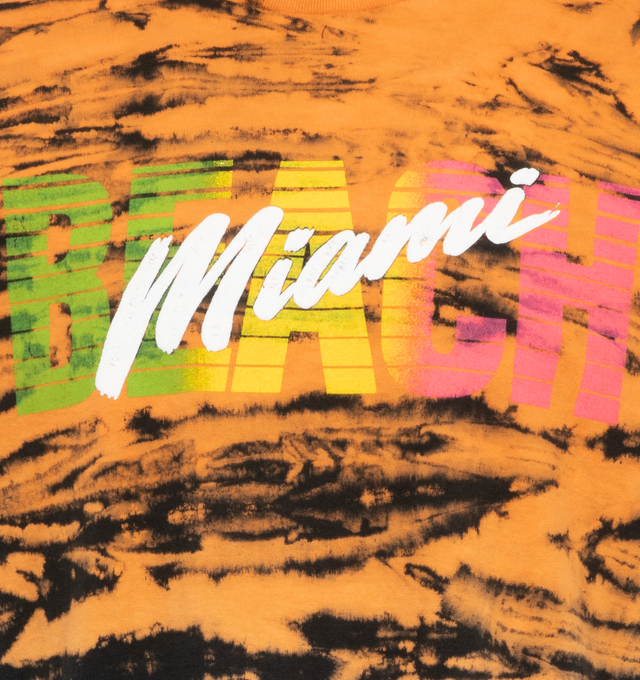 Image 3 of 4 - ORANGE - GALLERY DEPT. MIAMI TIME TEE features a horizontal 'tiger stripe' style tie-dye on a gradient silhouette. The front of the shirt is screen printed with the word 'Miami' done in a puff print fabrication and the back of the tee features a peace sign printed in fluorescent blue. 100% cotton. 