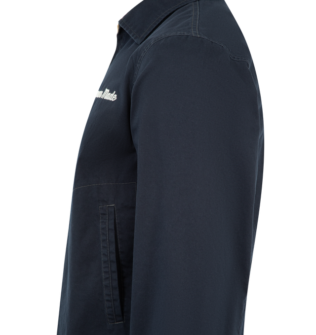 Image 3 of 3 - NAVY - HUMAN MADE Work Jacket featuring zip-up closure, a Duck graphic patch on the back, chain-stitched Human Made logo on the left chest, wide, boxy silhouette, thick, firm cotton twill fabric, polyester lining and heart button on each cuff. 100% cotton. Lining: 100% polyester.