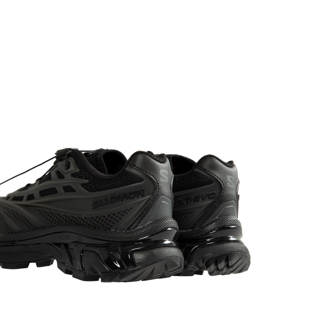 Image 3 of 5 - BLACK - Salomon Unisex XT-EVO Sneakers are built with a synthetic and textile upper and are made to be a performance-driven combining stability and cushioning for lasting comfort. Additional details include Quicklace one-pull lacing, endoFit internal sleeve construction, sensiFIT support, seamless construction, and a lace pocket for streamlined wear. A molded OrthoLite sockliner and Mud ContaGRIP rubber outsole enhance cushioning, durability, and traction across varied terrain. Upper: Synthet