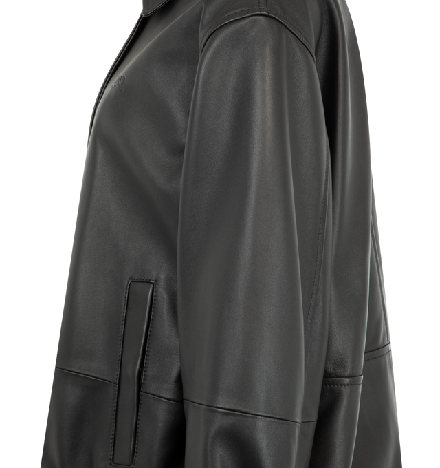 Image 4 of 4 - BLACK - Loewe Women's Drawstring Leather Jacket is crafted from lightweight nappa lambskin and features an adjustable drawstring hem. Designed with a relaxed fit and regular length, it is finished with a classic collar, concealed snap-button and zip-front fastening, snap-button cuffs, buttoned welt pockets, inside welt pockets, and a debossed Double L detail at the chest. Main Material: Nappa lambskin. Fully lined. Made in Spain.