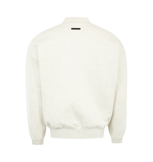 Image 2 of 2 - WHITE - FEAR OF GOD ESSENTIALS Signature 3/4 Sleeve 90s Polo featuring 380GSM core fleece, 90's relaxed silhouette, embroidered Essentials signature on the front, covered Henley placket, kangaroo pocket, rib-knit polo collar, cuffs and waist-hem and Essentials signature label is at the back collar. 80% cotton, 20% polyester.
