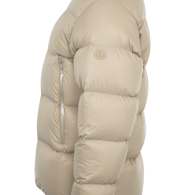Image 3 of 3 - NEUTRAL - Moncler Tarn Puffer Jacket has an adjustable hood, a zipper closure, zipper pockets, adjustable cuffs, an elastic hem at the back, and a silicone logo patch. Down filled. 100% polyamide. Made in Armenia.