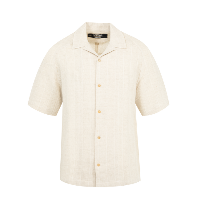 Image 1 of 2 - WHITE - JACQUEMUS Fonccio Shirt featuring ribbed jacquard bowling shirt, relaxed fit, textured cotton-linen, camp collar, boxy elbow-length raglan sleeves, embroidered J on the the sleeve, back yoke with "J" loop and mother-of-pearl buttons. 64% cotton, 36% linen. Made in France.