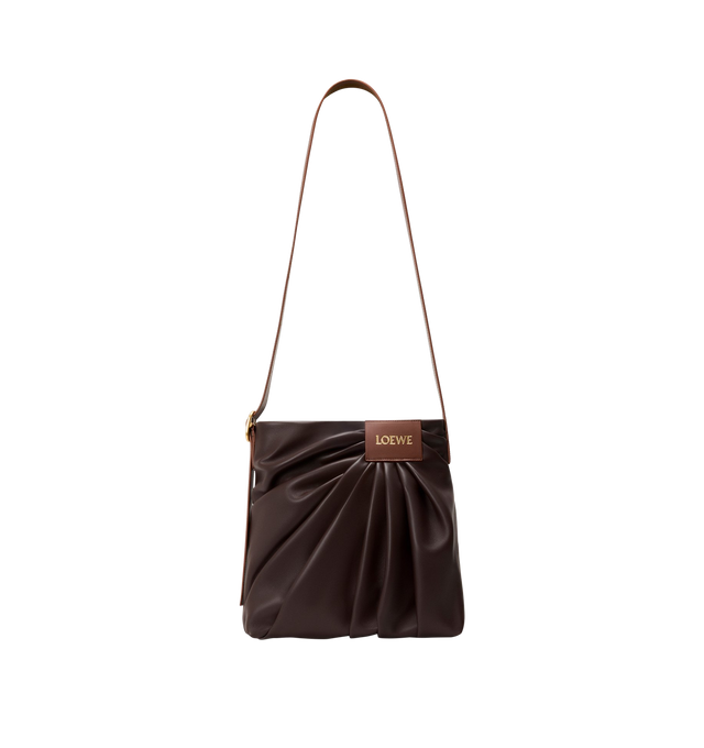 Image 3 of 4 - BROWN - LOEWE Draped Tote featuring soft scultpural shape and a wide strap adorned with a bold LOEWE-engraved buckle, shoulder or crossbody carry, adjustable strap, magnetic closure, one internal calfskin patch pocket, herringbone cotton canvas lining and gold embossed LOEWE. Mellow nappa lambskin. 30 cm x 29 cm x 13 cm. Made in Spain. This item may be restricted for online purchase to international clients. For assistance purchasing this item please contact our dedicated stylist team at pers