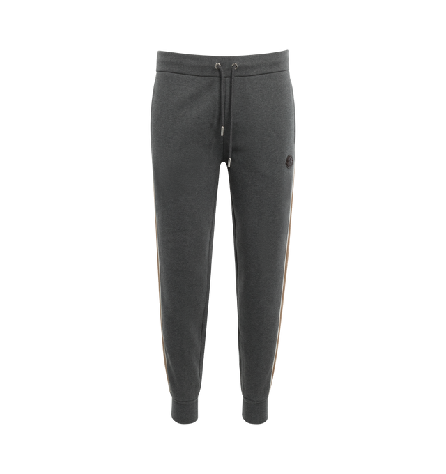 Image 1 of 3 - GREY - MONCLER COLOR BLOCK SWEATPANTS featuring contrasting-colored fabric back, fabric back side bands, nylon piping, waistband with drawstring fastening, side and back welt pockets, logo lettering and debossed leather logo. 80% cotton, 20% polyester. 