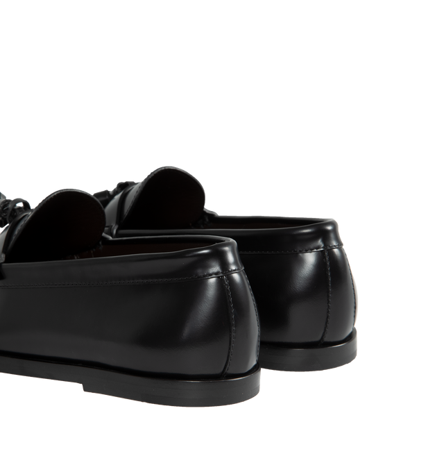 Image 3 of 4 - BLACK - THE ROW Loafer featuring sleek calfskin leather with natural pleating effect and tassel detailing. 100% leather. Made in Italy. 