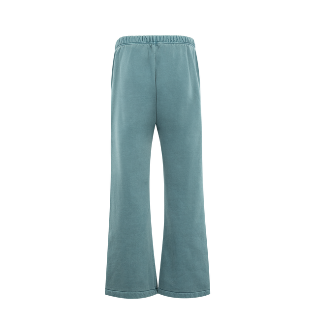 Image 2 of 3 - BLUE - FEAR OF GOD ESSENTIALS Signature Classic Flare Sweatpant featuring 520GSM heavyweight fleece, pigment-dyed, relaxed silhouette, flared leg, an encased elastic waistband with elongated drawcords, side-seam pockets, Essentials signature logo embroidered on the leg and an Essentials signature label at the center front. 100% cotton.