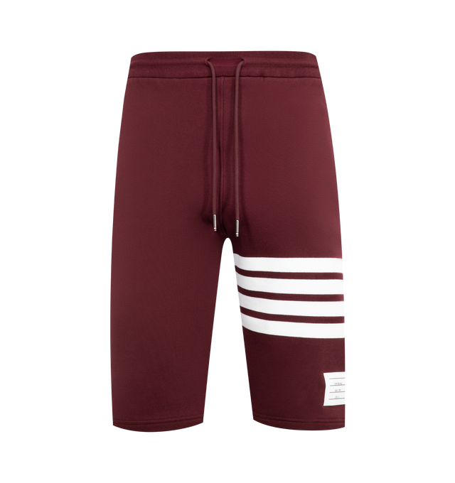 Image 1 of 3 - RED - THOM BROWNE Classic Loopback 4-Bar Sweatshorts featuring drawstring waistband with silver tone aglets, engineered 4-bar stripe detail at left thigh, name tag applique above left cuff, slip side pockets, single back welt pocket and signature striped grosgrain loop tab at back waist. 100% cotton. Made in Japan.