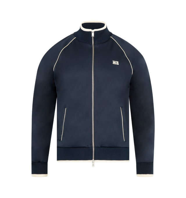 Image 1 of 3 - NAVY - WALES BONNER Motion Track Top featuring funnel collar, front zip closure, front pockets, embroidered WB at chest and contrast piping. 55% polyester, 45% cotton. Made in Portugal.