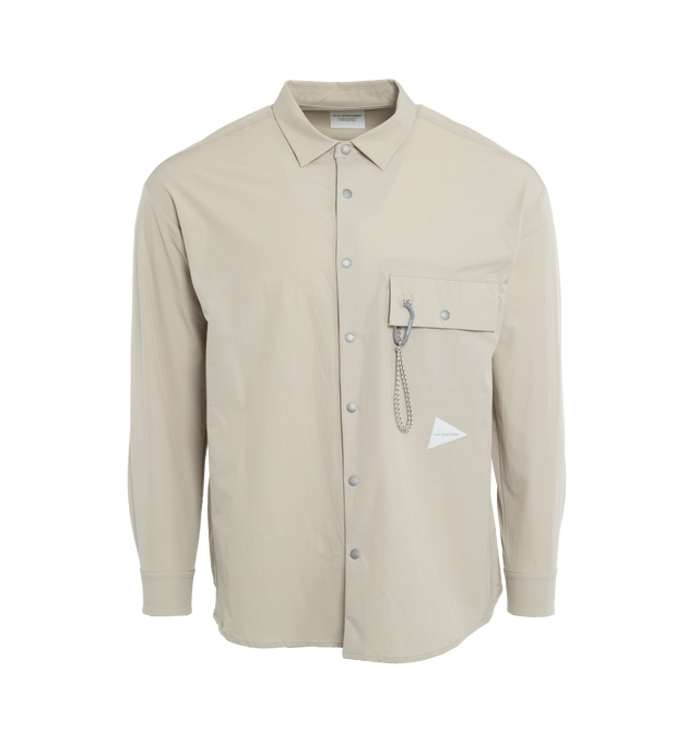 Image 1 of 4 - GREY - AND WANDER Light Cloth Shirt made of Taslan nylon with reduced gloss and a special double weave, the fabric has a matte surface and the ability to stretch in all directions, making it a comfortable material that also dries quickly. Features carabiner is attached to the chest pocket.  NYLON 87% POLYURETHANE 13%. 